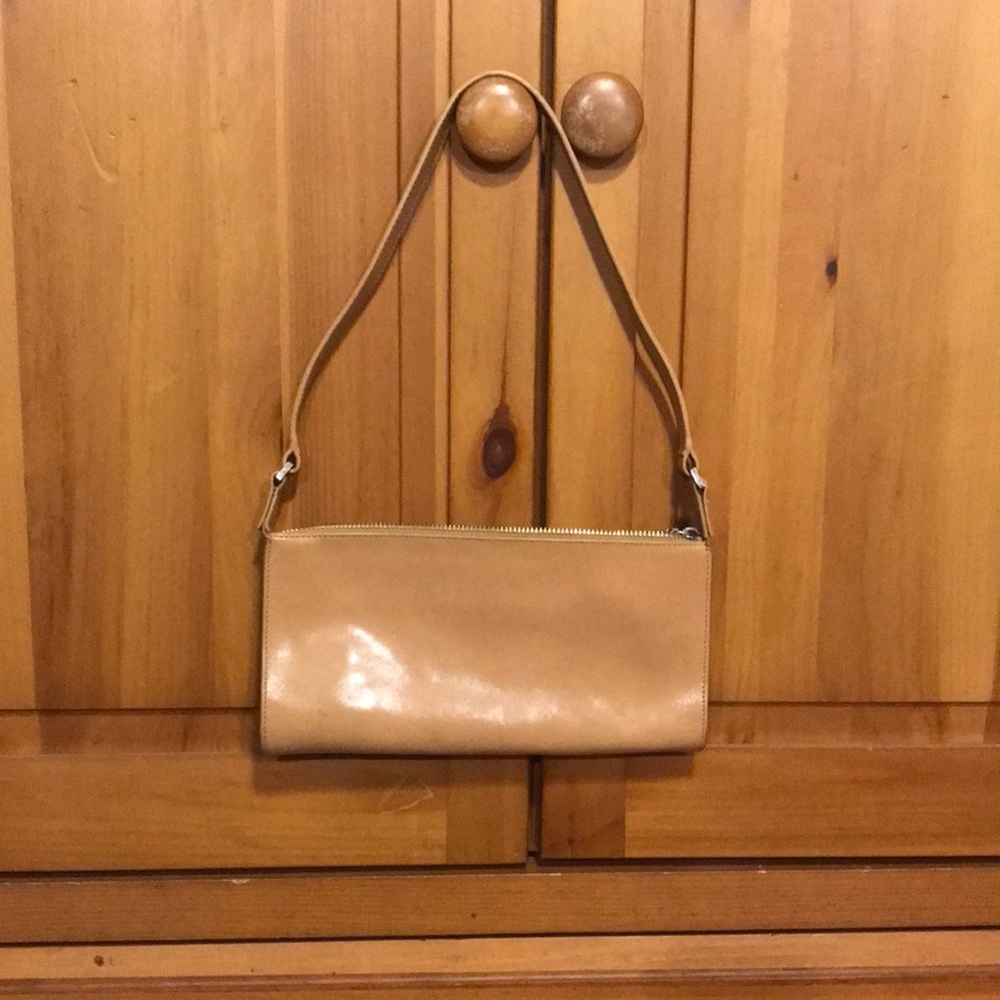 Small shoulder or clutch purse. Says Monsac on inside fabric.
